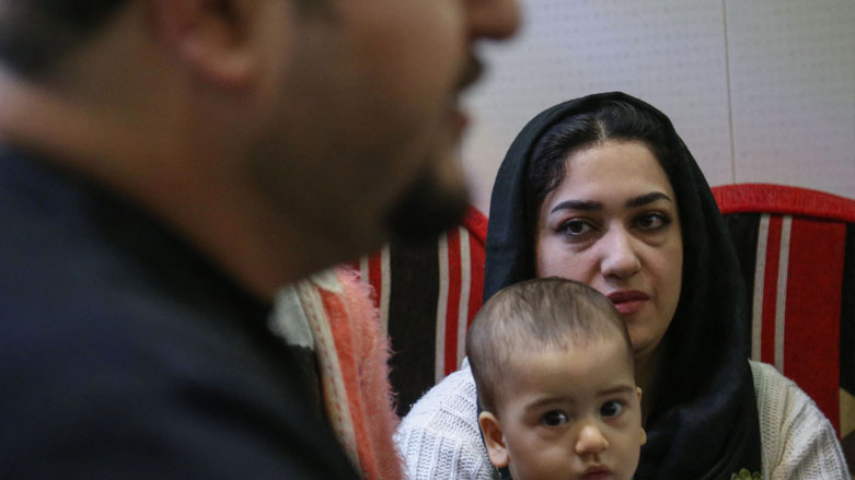 Iraqi engineer Hassanein Mohsen speaks as he sits with his family at home in the central holy shrine city of Karbala, Dec. 12, 2020. (Photo: Mohammed Sawaf / AFP)